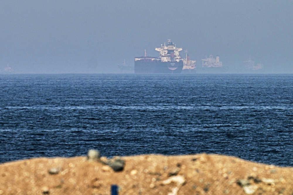 Cargo ships at sea near the Strait of Hormuz (Fatima Shbair/AP) (AP)