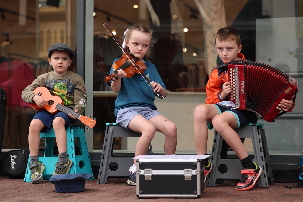 Donal McCormack, 6, Eilish McCormack, 7, and Senan McCormack, 10, played Irish traditional music in Belfast during the Fleadh Cheoil na hEireann 2026 (Liam McBurney/PA) (PA Wire)