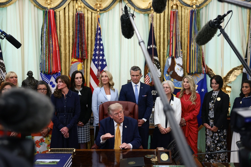 Trump gave his latest remarks on Iran surrounded by military spouses at the White House (Reuters)