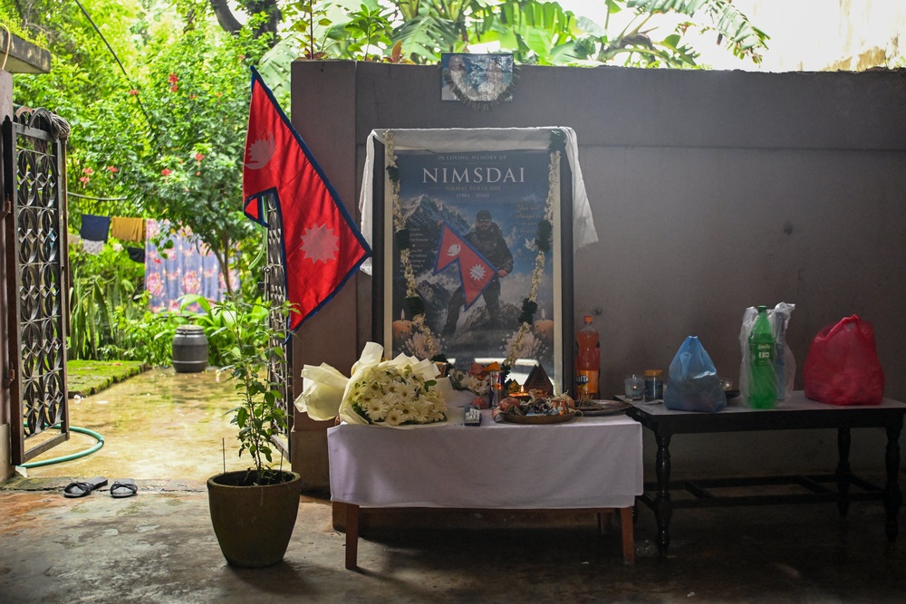 A garlanded portrait of Nirmal Purja is seen at his home in Chitwan on 3 August 2026 (AFP/Getty)