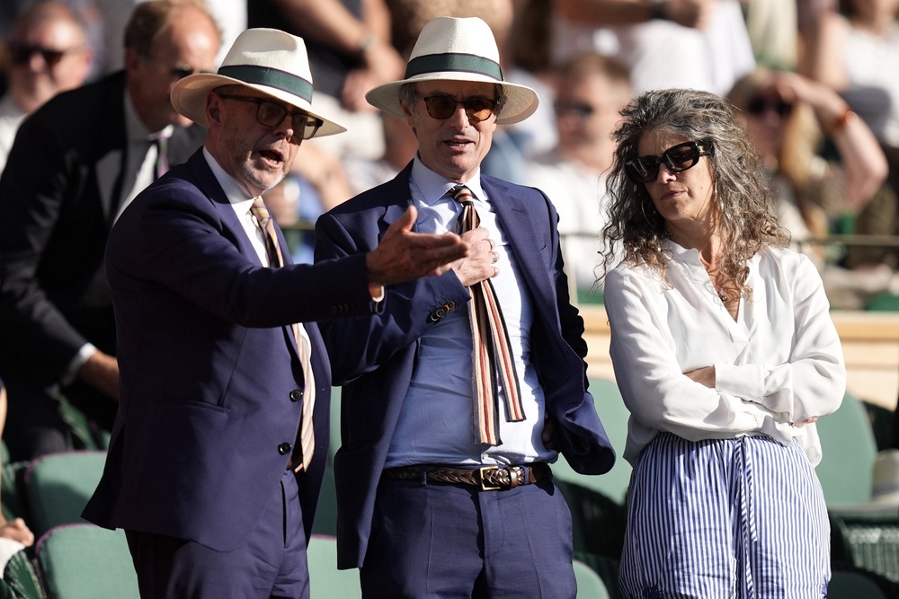 From left: Nick Robinson, Robert Peston and his new partner Nell Breyer at Wimbledon this year (PA)