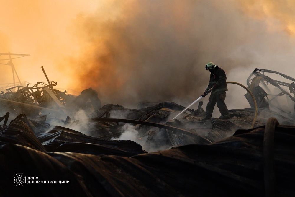 In this photo provided by the Ukrainian Emergency Service, a firefighter puts out a fire following a Russian missile attack in Dnipropetrovsk region, Ukraine, Tuesday, Aug. 4, 2026 (Ukrainian Emergency Service via AP)