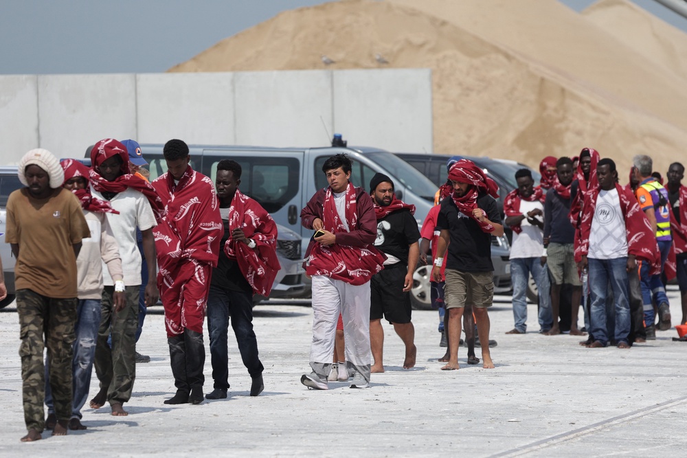Some of the migrants, pictured after disembarking from a French rescue ship (AFP/Getty)