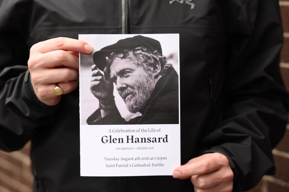 The Order of Service is held up ahead of the funeral of Glen Hansard (Damien Eagers/PA) (PA Wire)