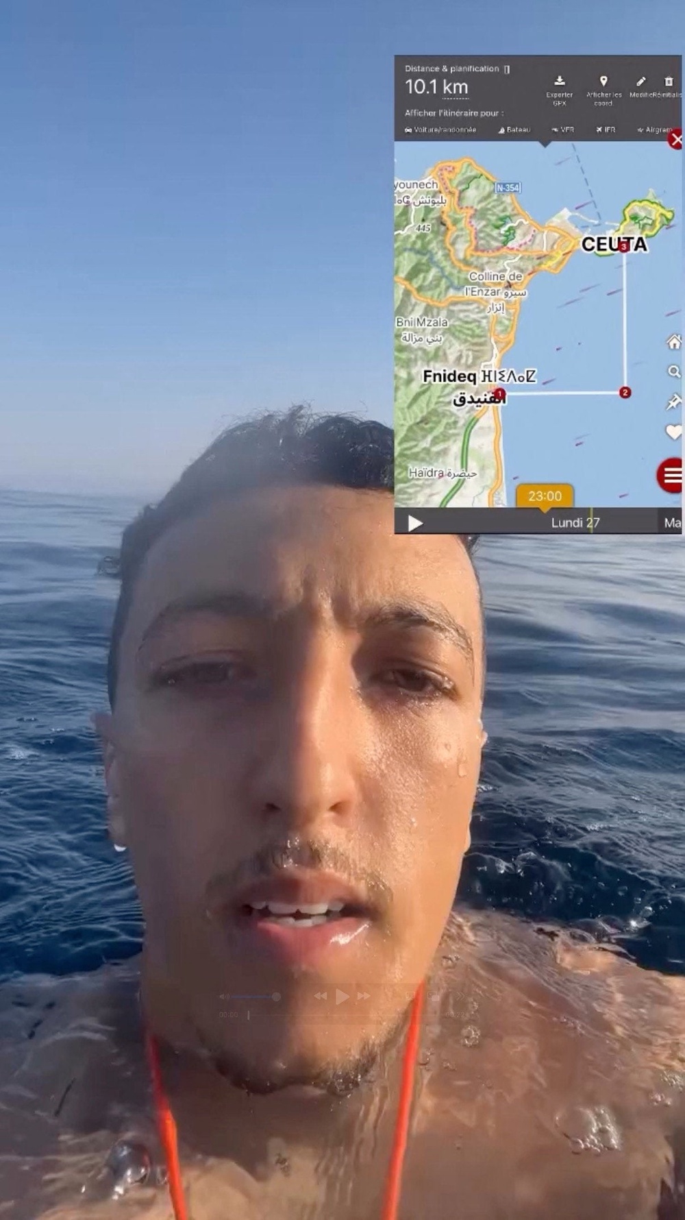 A migrant films himself while swimming off the coast of Ceuta, Spain, in this screengrab taken from social media video released on July 28, 2026 (Social media)