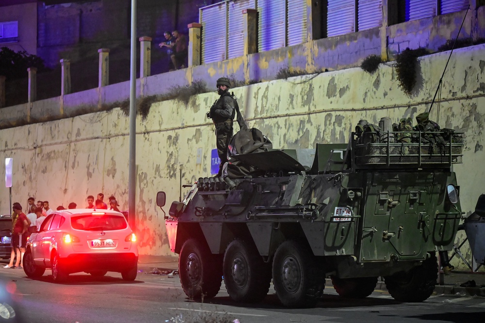 Spanish military stands guard at the border on 30 July (Reuters)
