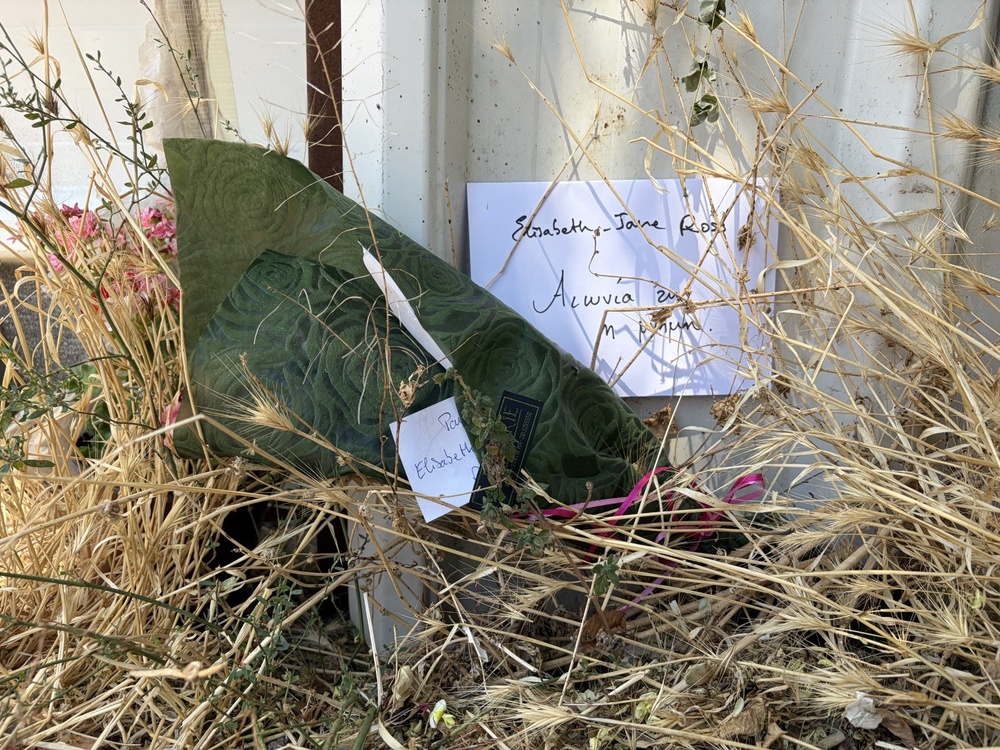 Floral tributes have been left outside the abandoned building where Ms Ross’ body was discovered (PA)