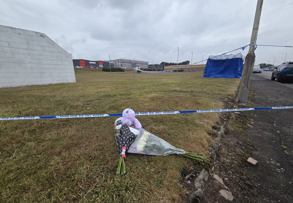 Floral tributes have been left at the scene (Rachel Keenan/PA) (PA Wire)