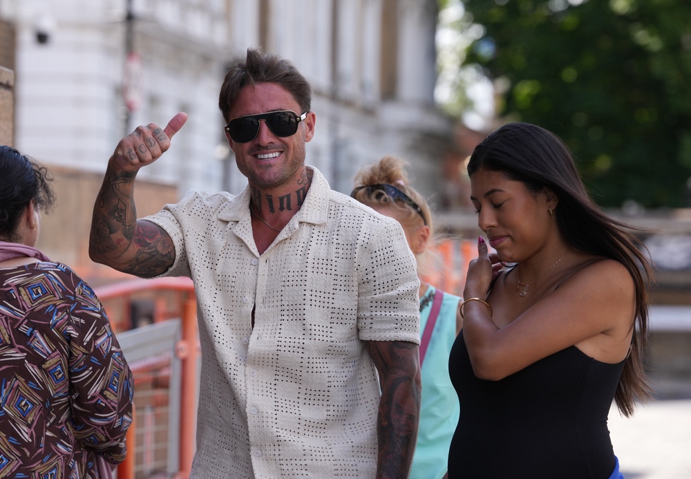 Stephen Bear arrives at Thames Magistrates' Court, east London, with his partner, Miami (PA)