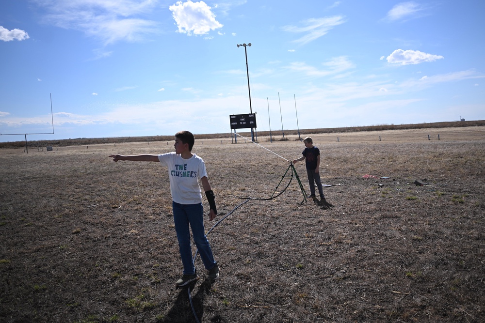 Kids play with the sprinkler on a drought-parched field in Vilas, Colorado, in May. The state has seen fewer mosquitoes this year, but more cases of West Nile virus following the spring’s historic drought (Getty Images)