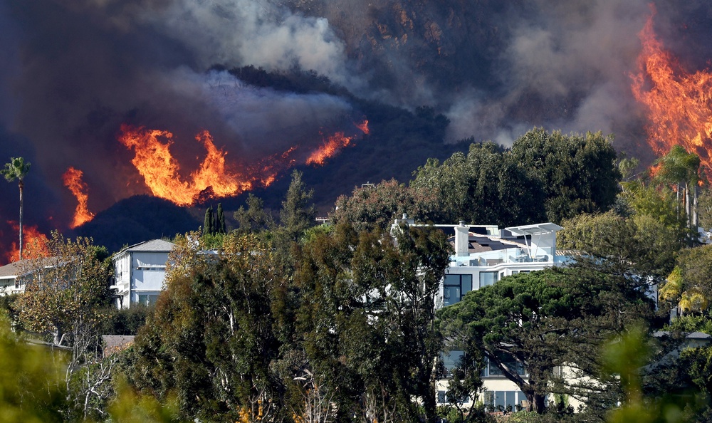 As the Palisades and Eaton fires raged through Southern California in January 2025, people reportedly spent $1.2 million on Polymarket betting on them (Getty Images)
