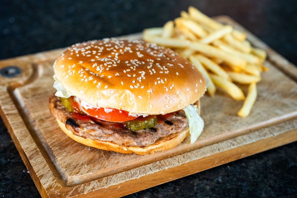 A photo shows a vegetarian hamburger 'veggie burger' with a side of fries on a wooden cutting board (AFP/Getty)