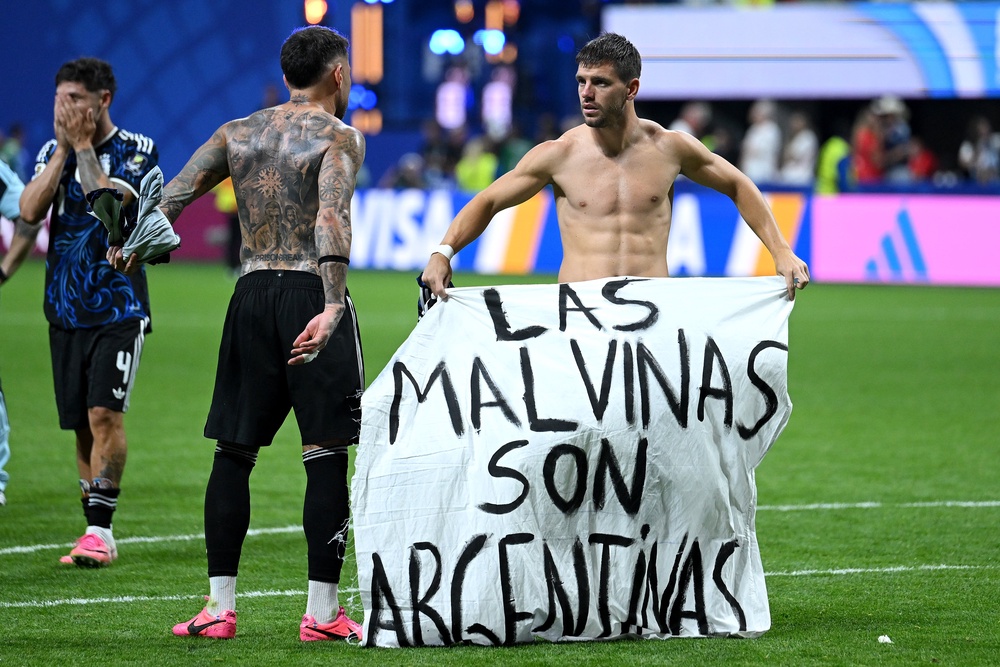 Argentina players unfurled a banner which read “Los Malvinas son Argentinas”, translated to “The Falklands are Argentine”, after the win (Getty)