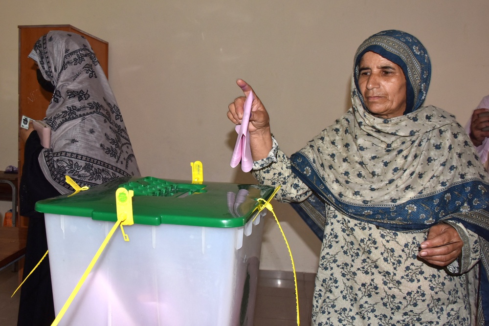 A  woman casts her ballot during the second phase of regional elections in Muzaffarabad (AFP/Getty)