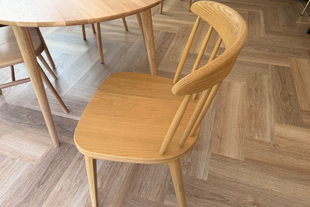 The chairs come with a care guide in the box, which includes useful advice on how to look after the wood (Emily Peck/The Independent)