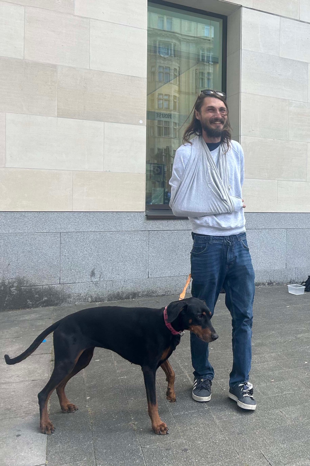 Alex Jenkinson, 39, stands outside Westminster Magistrates' Court with his dog, Indie. (PA)
