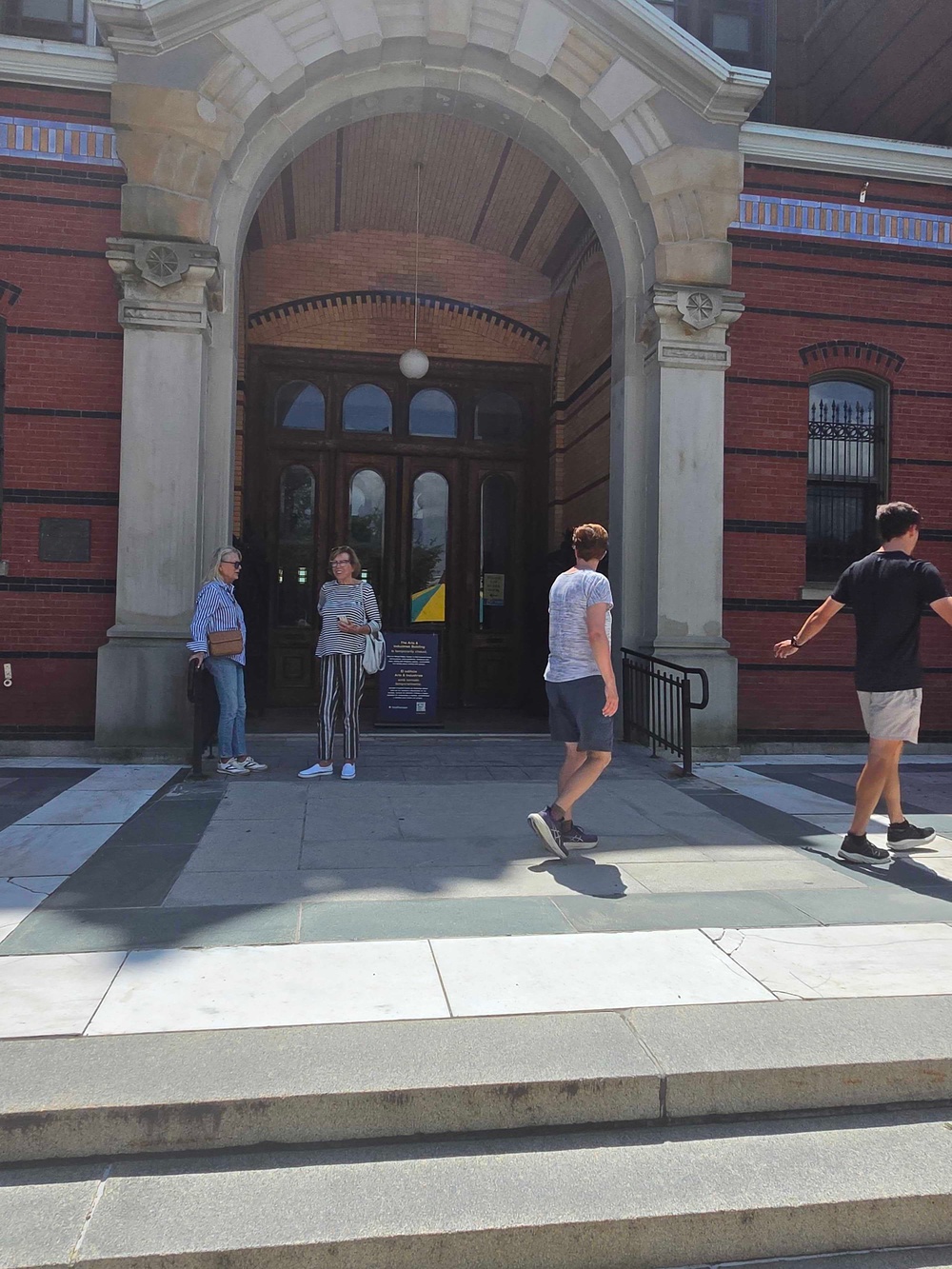 People outside the Smithsonian Arts & Industries Building after it was temporarily closed (John Bowden / The Independent)
