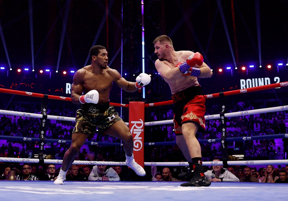 Joshua climbed off the canvas twice in round one to stop Prenga in round two (Reuters)