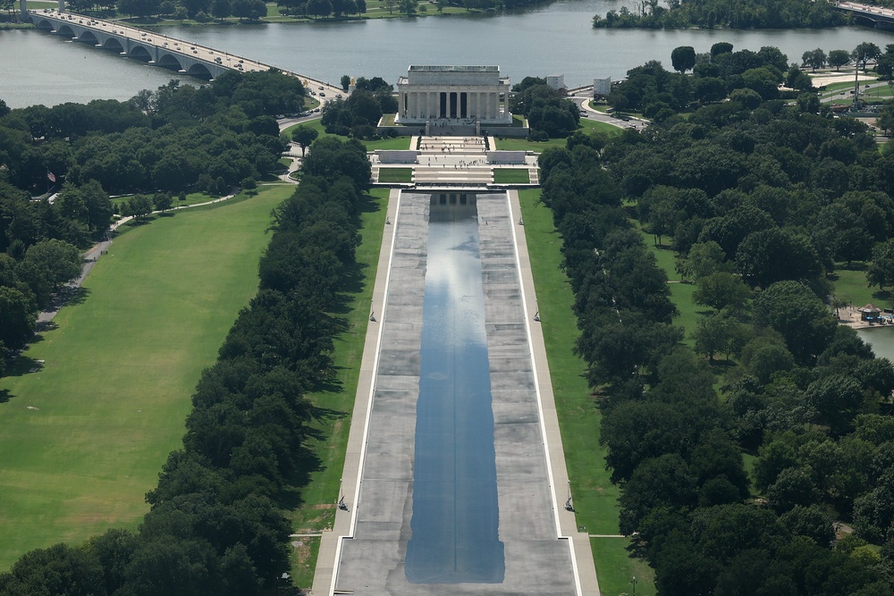 Trump continues to insist that vandals were responsible for cutting the recently applied lining of the Reflecting Pool despite his own administration appearing to admit that there is no evidence to support his claims (Getty)