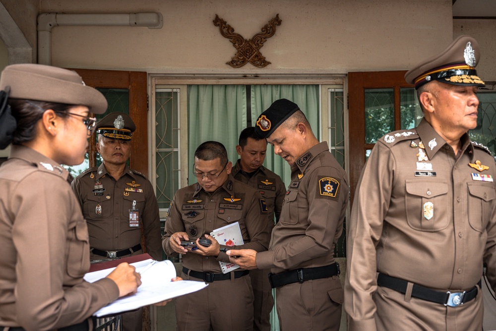Police gather outside the house where a teenage suspect is suspected of killing his grandparents before carrying out a school shooting in Nonthaburi province, north of Thailand' (AFP/Getty)