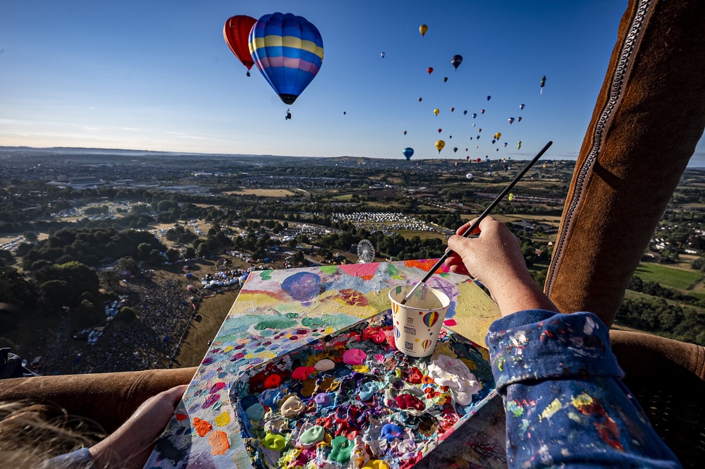 Artist Emily Powell pictured in a hot air balloon basket (Ben Birchall/PA) (PA Wire)