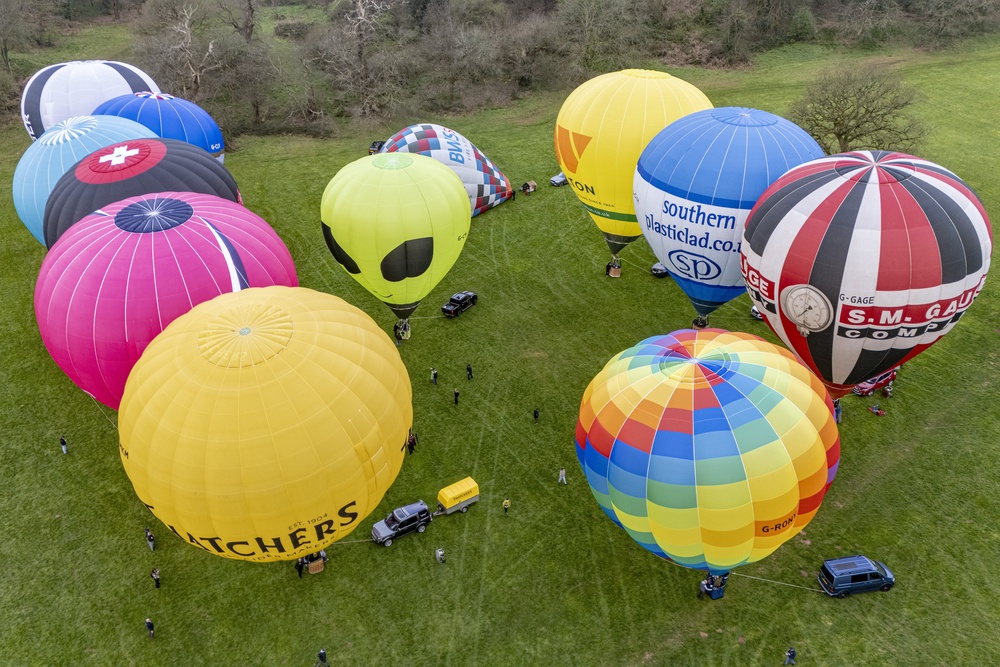 Hot air balloons bobble on the ground at Ashton Court Estate, Bristol, as balloon crews prepare for the 2026 Bristol Balloon Fiesta (Ben Birchall/PA) (PA Wire)