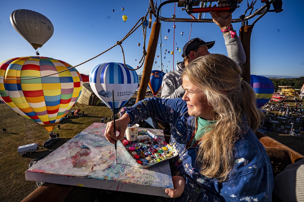 Artist Emily Powell took to the skies to paint from a hot air balloon basket (Ben Birchall/PA) (PA Wire)