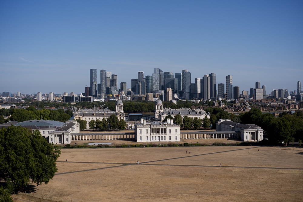 A person walks on the scorched grass in Greenwich Park, London (Jordan Pettitt/PA) (PA Wire)