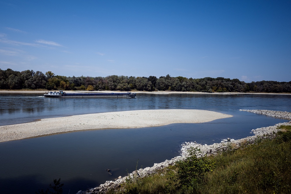 A ship travels upriver in the low water of the Danube River during a heatwave near Bad Deutsch-Altenburg an der Donau, Austria, 6 August 2026 (Reuters)