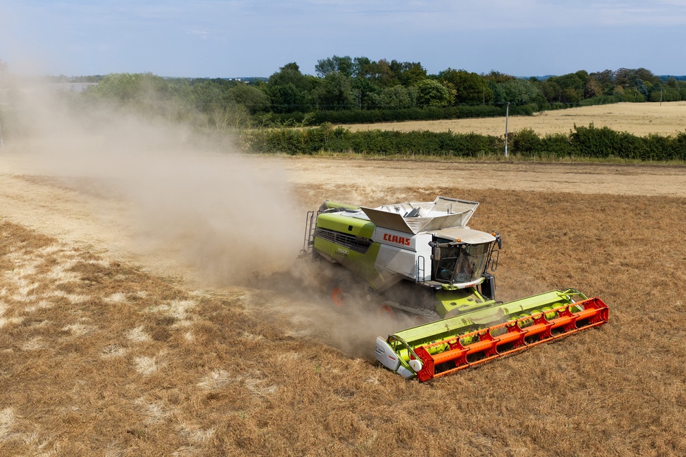 A combine harvester crosses parched fields in Suffolk (AFP/Getty)