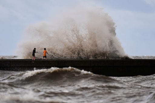 Children play near breaking waves from Tropical Storm Bertha in New Orleans, Louisiana, last month. There have been no hurricanes in the Atlantic yet (AP)