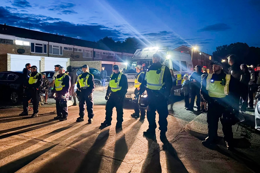 Police face right-wing protesters on a residential street in Thetford, Norfolk last Thursday (Scott Hussey/Norfolk County Council)