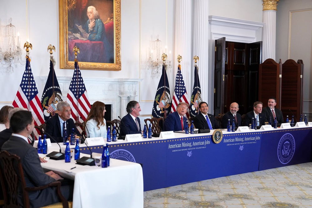 President Donald Trump admires the decor in the room during a roundtable on the American mining industry at the US Department of State in Washington, DC (Getty)
