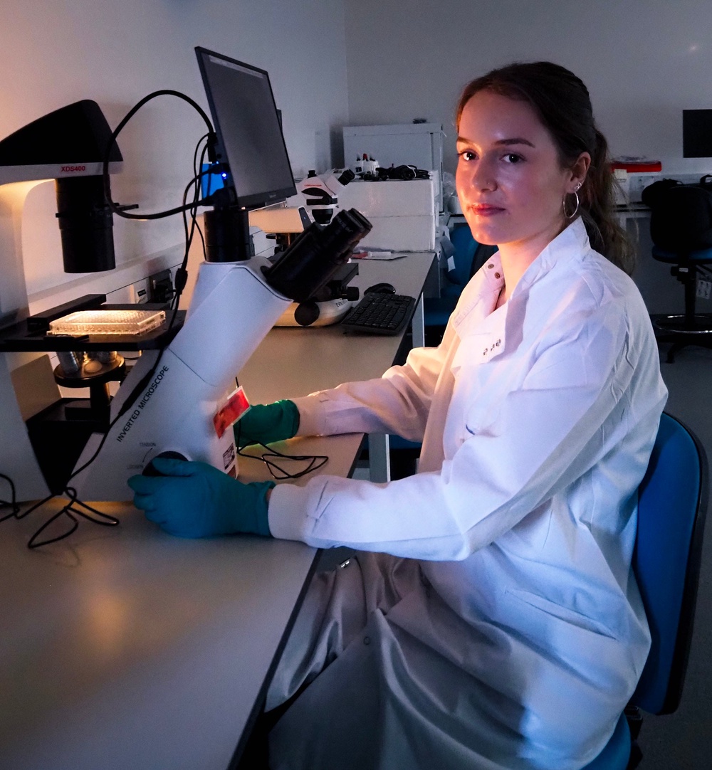 A student examining cancer cells in the lab at the University of Essex. (University of Essex/ PA)