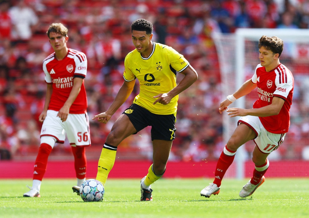 Borussia Dortmund's Jobe Bellingham in action with Arsenal's Christos Tzolis (Reuters)