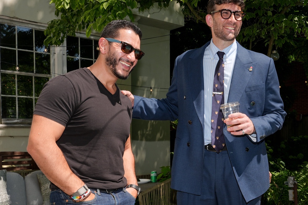 El-Sayed talks poolside with streamer Hasan Piker at a party for content creators supporting his campaign on Aug. 3 in Detroit (AP)