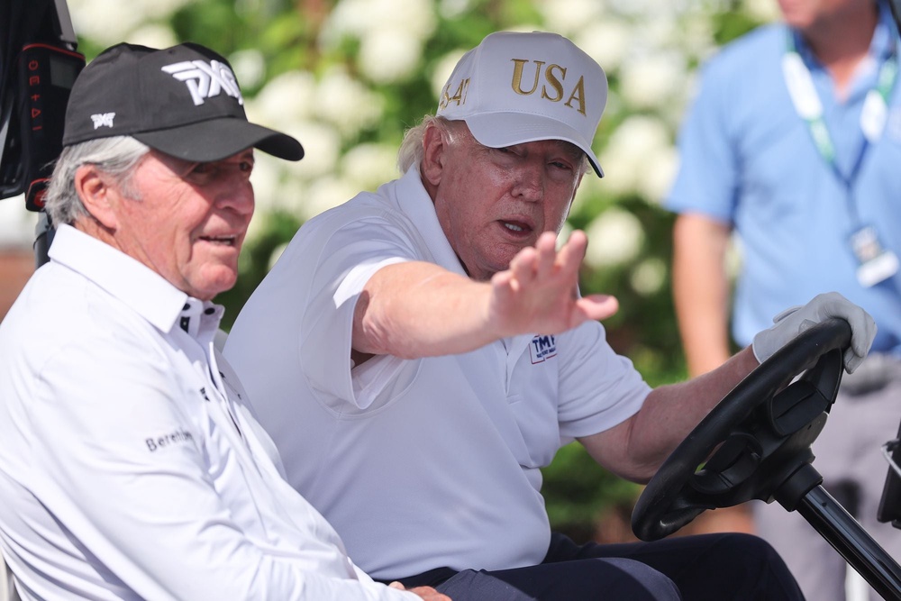 President Donald Trump posted a touched-up photograph of himself from his weekend golf trip, along with Gary Player, where he appeared much younger, instead of sharing the original image (Icon Sportswire/Getty)