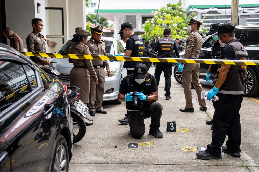 Forensics police officers gather evidence at the Nonthaburi Provincial Administrative Organization (PAO) office in Nonthaburi province, north of Bangkok (AFP/Getty)