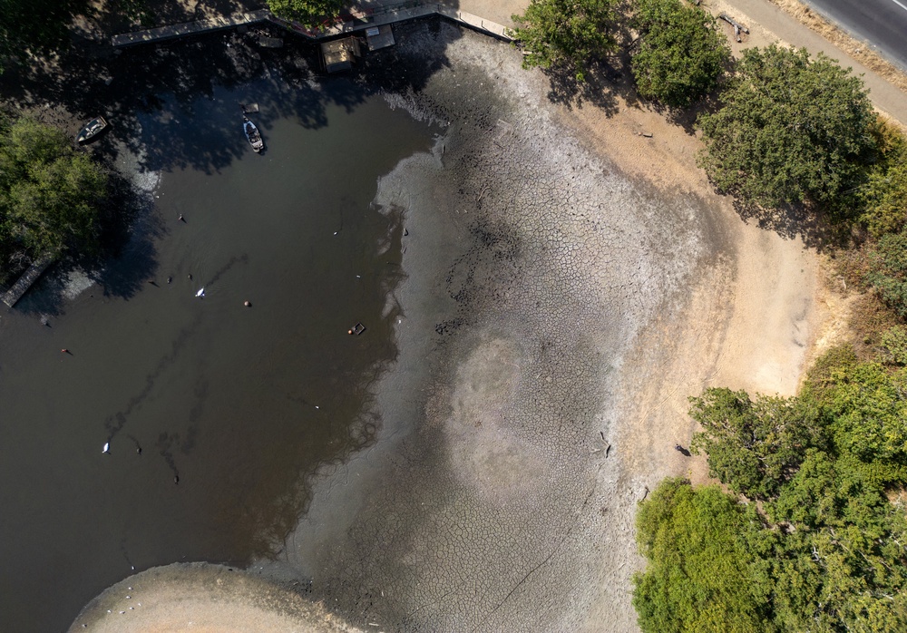 An aerial view shows the dried and cracked bed of the depleted Hollow Pond and Leyton flats near Wanstead, east London (AFP/Getty)