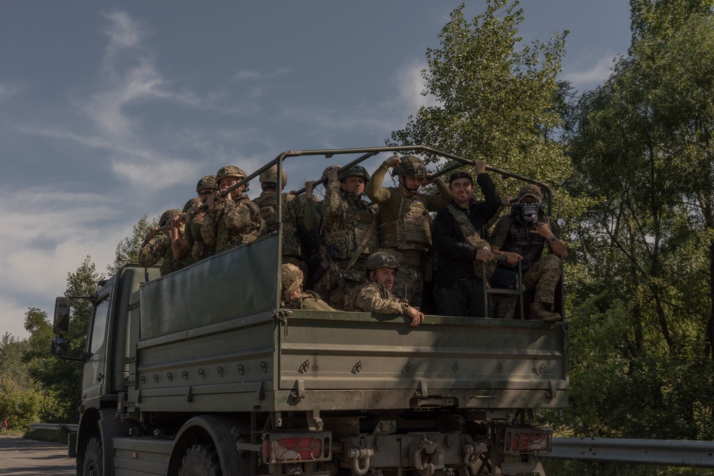 Ukrainian soldiers travel along a road in the Kharkiv region (AFP/Getty)
