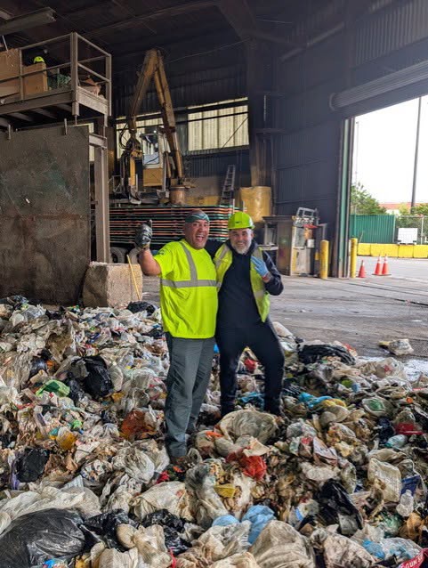 The two workers were all smiles in photos posted by New York City’s Sanitation Department Friday, announcing the remarkable discovery (New York City Department of Sanitation)