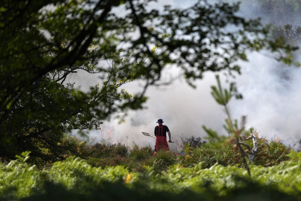 The blaze started on Sunday after a van caught fire nearby (Andrew Matthews/PA) (PA Wire)