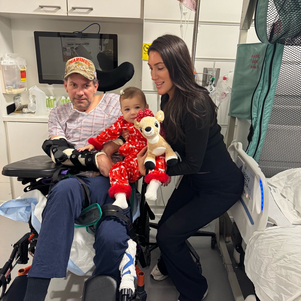 Joseph Belgio, pictured with fiancee Melanie Stayer and daughter Carmela, suffered brain damage after allegedly being served contaminated oysters at a suburban Chicago steakhouse (GoFundMe)