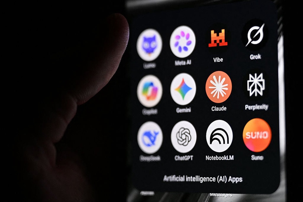 A smartphone displaying the icons of artificial intelligence apps, pictured in Saint-Mande, east of Paris, on 15 July, 2026 (AFP via Getty Images)