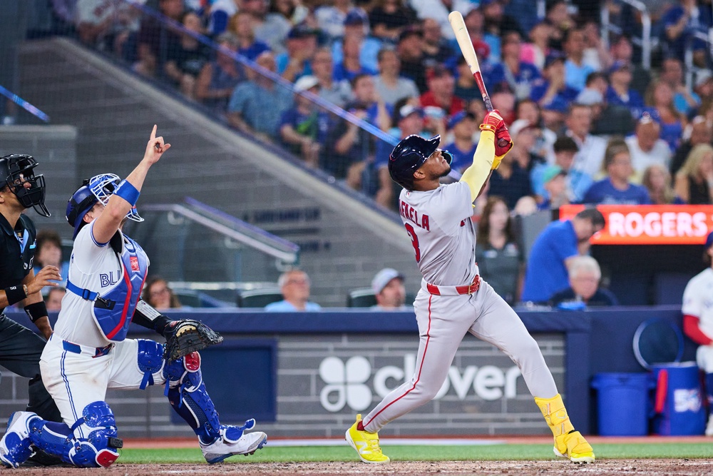 Boston Red Sox's Ceddanne Rafaela, right, flies into a sacrifice double play that was reviewed with a time play allowing Anthony Seigler (not shown) to score (AP)