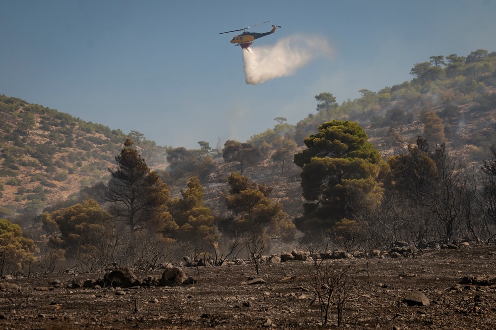 Bell firefighting helicopters have been deployed across the country (AFP/Getty)