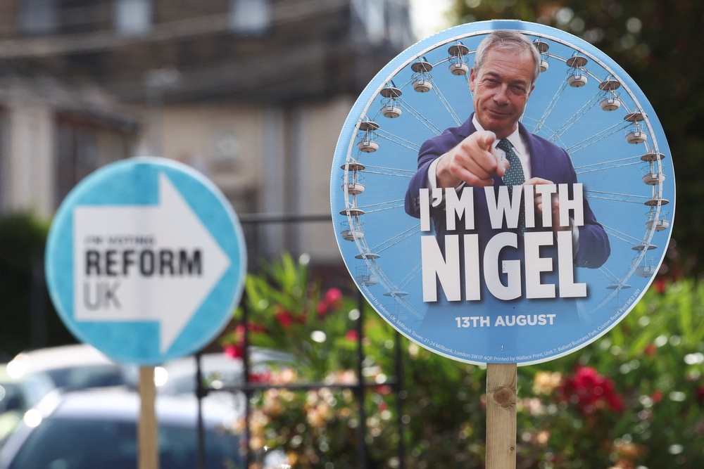 A Nigel Farage placard stands ahead of a by-election triggered by Reform UK party leader (Reuters)