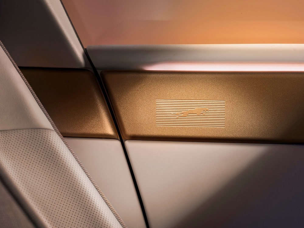 The new Jaguar leaper features subtly inset into brass on the top of the Type 01's doors (Jaguar)