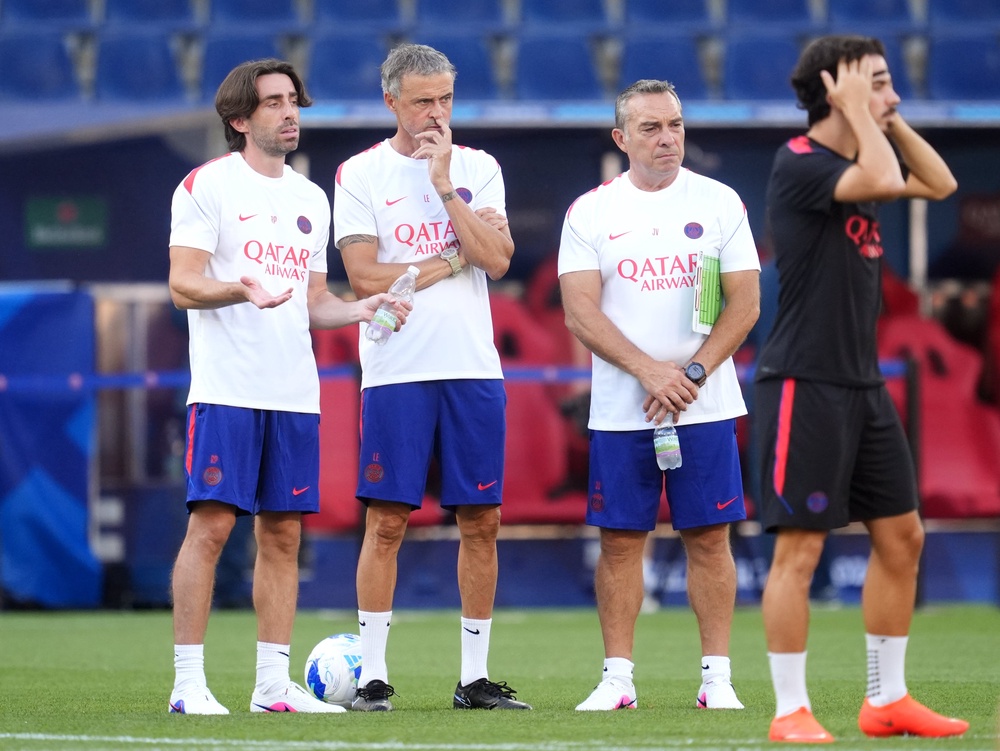 Luis Enrique (second left) was unwilling to speak about Barcola’s future (PA Wire)