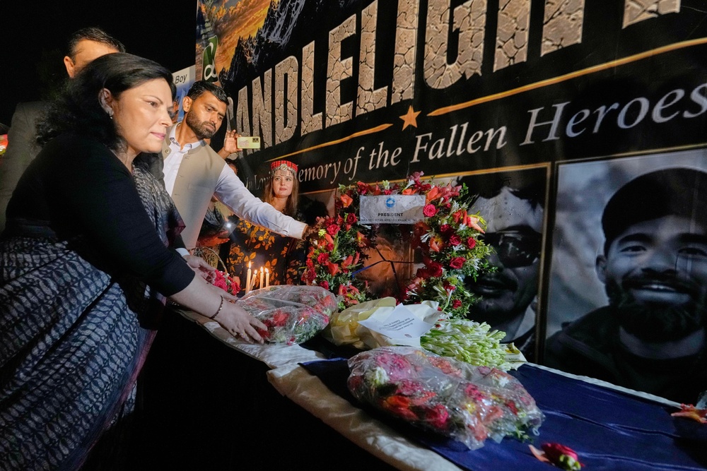 Nepalese Ambassador to Pakistan Rita Dhital, left, and others mourn the climbers who died in the avalanche (AP Photo/Anjum Naveed)